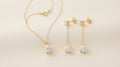 Gold pendant necklace and matching drop earrings gift set